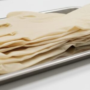 Latex examination handgloves